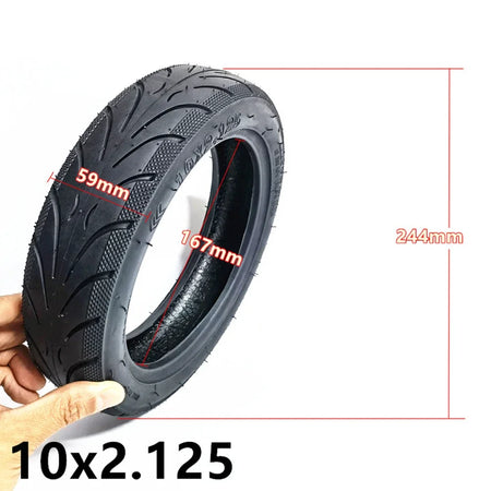 10x2.125 outer tire and inner tube flat lay on white background
