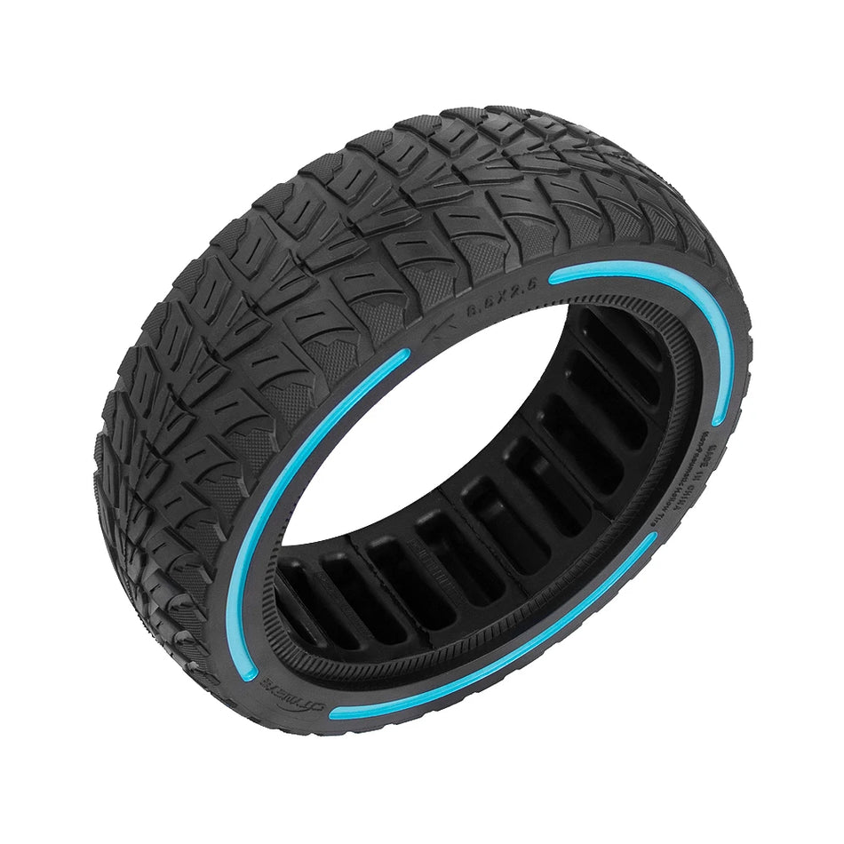 Close-up of deep off-road tread pattern on 8.5-inch solid rubber tyre