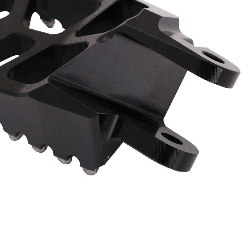 Dirt bike foot pegs designed for motocross racing performance