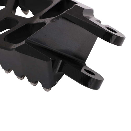 Dirt bike foot pegs designed for motocross racing performance