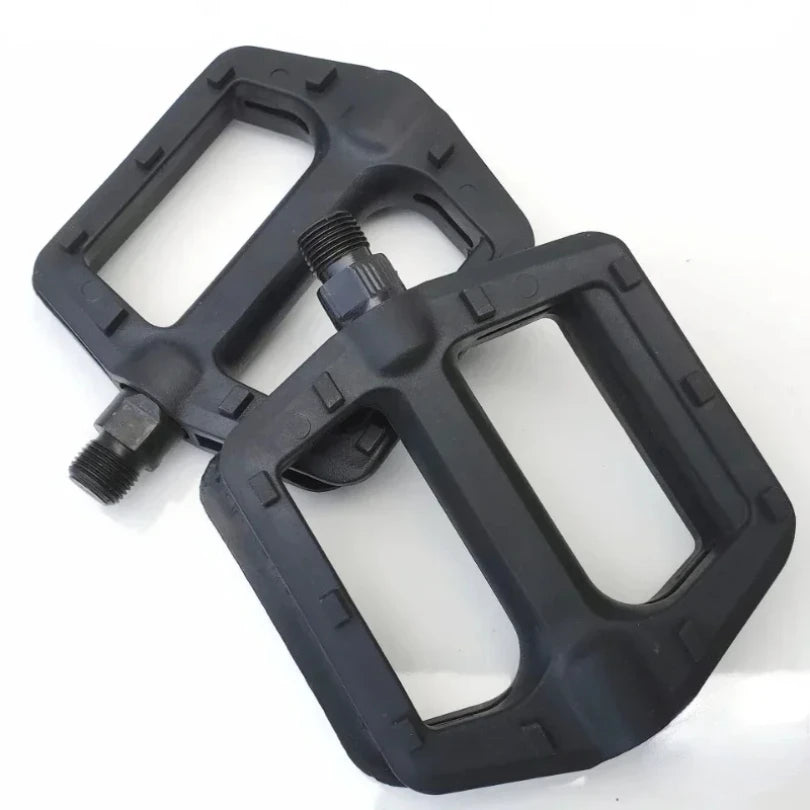 Flat wide bicycle pedals for better grip and stability