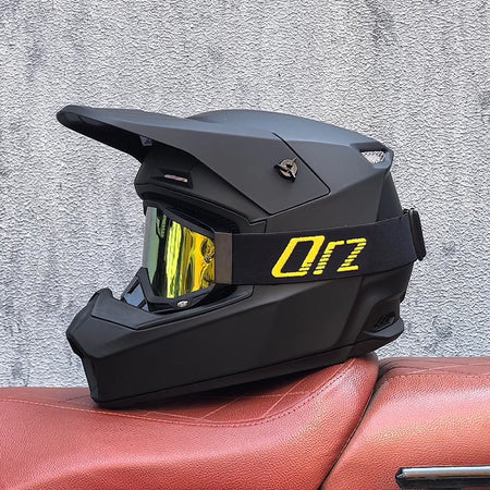 Full face helmet with abrasion resistant outer shell