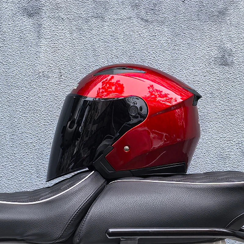 Rider wearing double visor motorcycle helmet on open road
