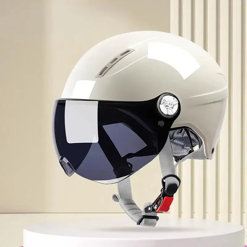 Lightweight motorcycle and e-bike helmet front view with sun visor extended