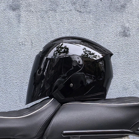 All-weather riding helmet with inner sun visor deployed